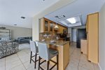 Kitchen with Granite Counters and Breakfast Bar